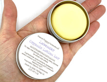 Load image into Gallery viewer, Lavender lotion bar in palm of hand
